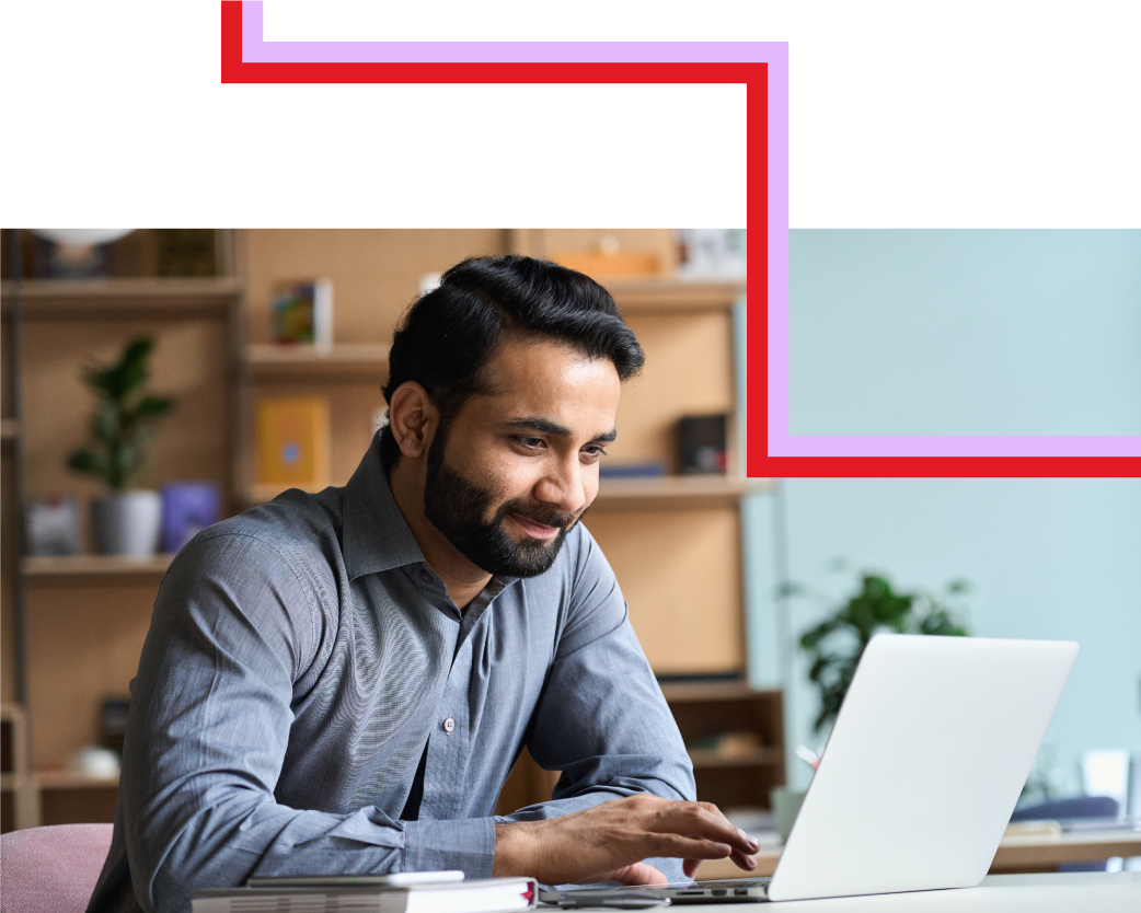 Person working on their laptop with a red and light violet pathway overlay on top. 